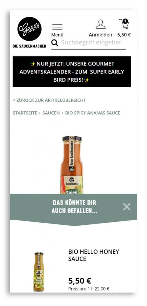 Mobile Produktdetailseite, auf dem ein Warenkorb-Layer mit Cross-Selling-Empfehlungen eingeblendet wird als Beispiel für Mobile Commerce.